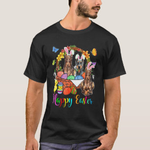T-shirt Trois chiens doberman de lapin dans un panier d'œu