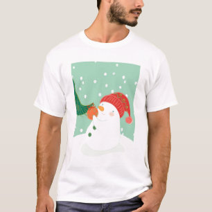 T-shirt Un bonhomme de neige accrochant un ornement sur un