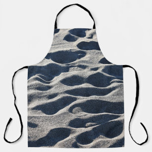 Tablier Empreintes de pieds sur sable pendant la journée