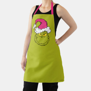 Tablier Grinch avec chapeau de Père Noël rose