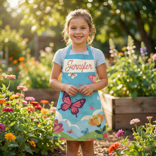 Tablier Papillons et jardin floral sous un ciel bleu fanta