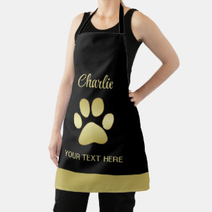 Tablier Paw chien brillant or sur arrière - plan noir