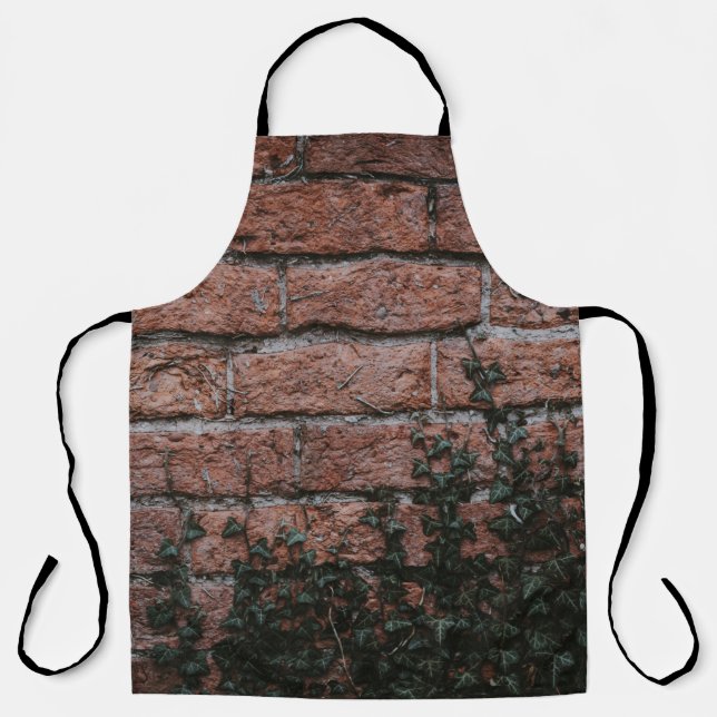 Tablier Plantes à feuilles vertes près du mur de briques (Recto)