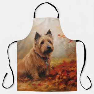 Tablier Terrier Australien dans les feuilles d'automne qui