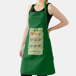 Tablier vert avec fleurs dans des tasses à thé