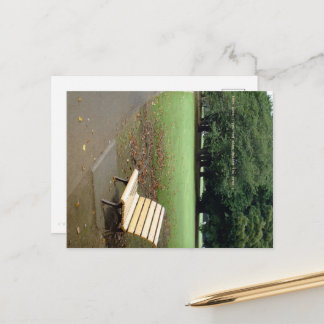Taking a short break on a park bench. postkarte