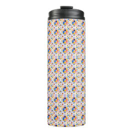Tall travel mug with a vibrant, geometric pattern thermosbecher