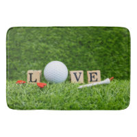 Ball de golf avec mot d'amour et tee-shirt vert