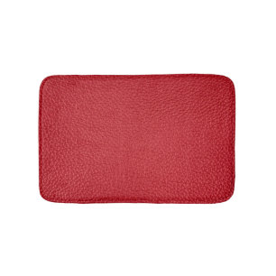 Tapis De Bain Closeup en cuir artificiel rouge foncé.