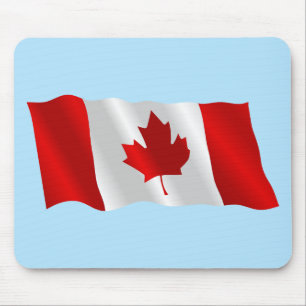 Tapis De Souris Drapeau canadien dans le vent sous ciel bleu