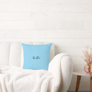 Tapisserie bleu bonjour jeté sur un coussin