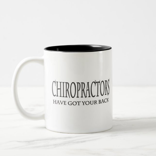 Tasse 2 Couleurs Les chiroprakteurs ont votre dos (Gauche)