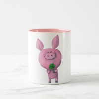 Porc chanceux avec le trèfle chanceux de quatre