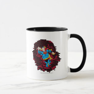 Tasse À travers un mur de briques