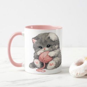 Tasse avec un mignon chaton et du fil rose