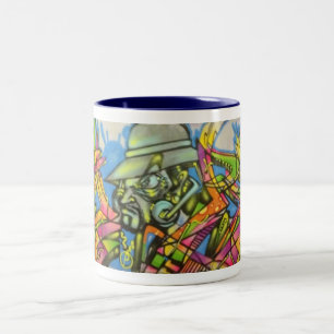 Tasse brûlante d'art d'homme par le ballot