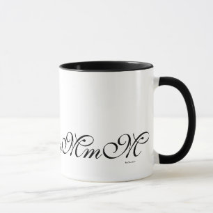 Tasse de café noire de motif de l'initiale M de