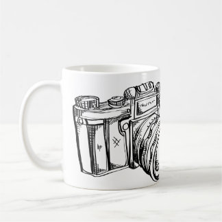 Tasse de café noire et blanche d'appareil-photo