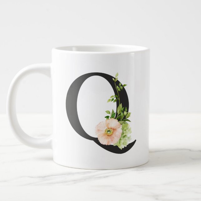 Tasse der Aquarellfarben mit dem Buchstaben Q (Links)