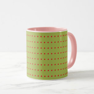 Tasse der grünen und roten Polka-Dots