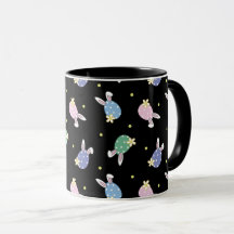 Tasse der Ostereier in Schwarz und Pastellfarben