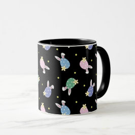 Tasse der Ostereier in Schwarz und Pastellfarben