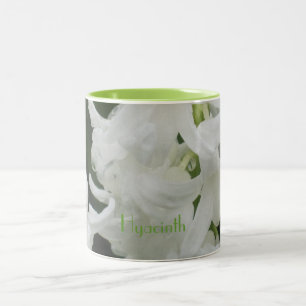 Tasse der weißen und grünen Hyazinthe-Blume