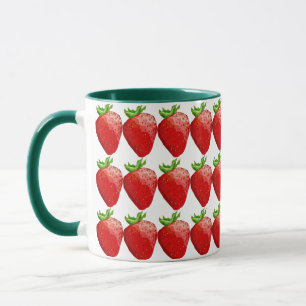 Tasse des grünen und roten Erdbeerkaffees