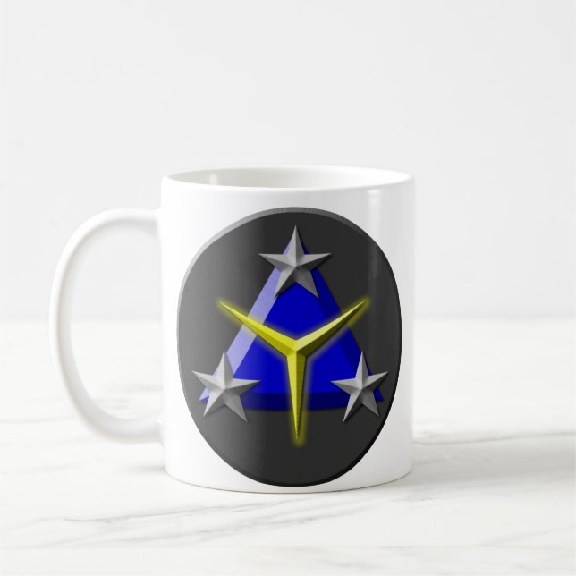 Tasse des Spielzeug-Insignia/TYCS (Links)