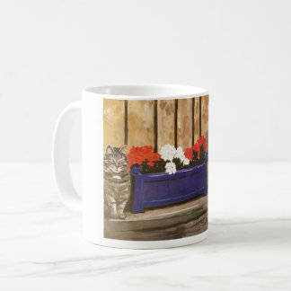 Tasse, die Katzen- und Blumenkasten kennzeichnet Kaffeetasse