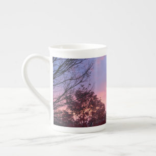 Tasse En Porcelaine Coucher De Soleil Rose Sur Les Arbres