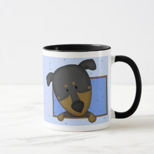 Tasse encadrée de Pinscher de dobermann de bande