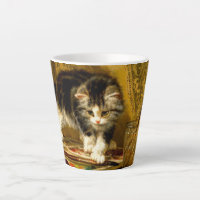 Chaton avec peinture et pinceaux