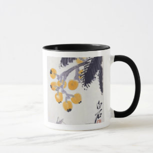 Tasse Loquats et une sauterelle
