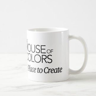 Tasse mit dem Haus des Farblogos