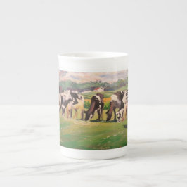 Tasse mit dem Weiden lassen der Kühe