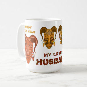 TASSE MIT TRADITIONELLER MASKENKUNST