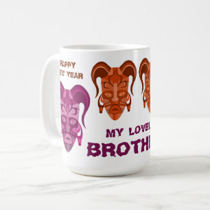TASSE MIT TRADITIONELLER MASKENKUNST