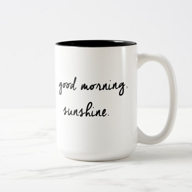 Tasse noire et blanche de soleil bonjour (Droit)