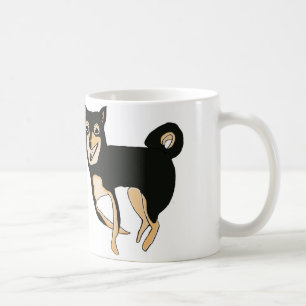 Tasse noire et bronzage drôle et mignonne de chie