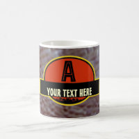 Tasse préhistorique de monogramme de "A"