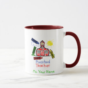 Tasse préscolaire de professeur - école et crayo