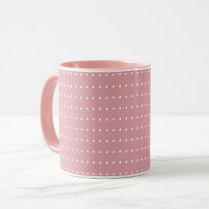 Tasse rose et blanche de pois