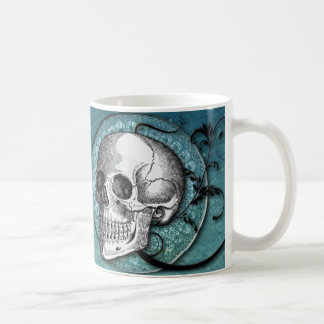 Tasse turquoise de crâne et de café de remous