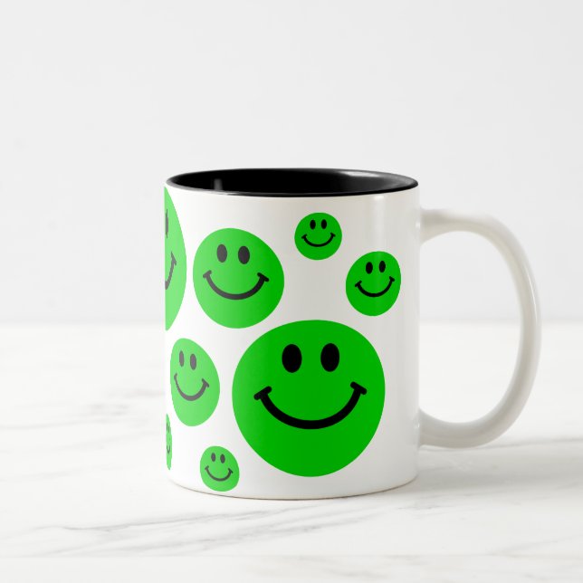 Tasse verte de visages (Droit)