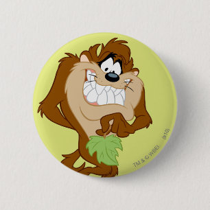 TAZ™ hält ein Blatt Button