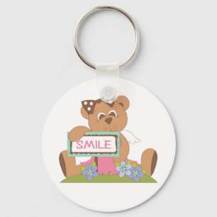 Teddy Bear mit Bow Holding Smile Sign Schlüsselanhänger