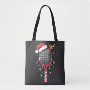 Tennissattel mit Weihnachtsmannmütze und Weihnacht Tasche