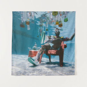 Tenture Man sitting on chair underwater with floating bott