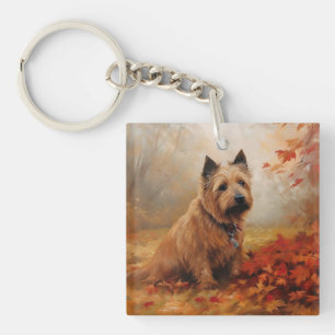 Terrier Australien dans les feuilles d'automne qui
